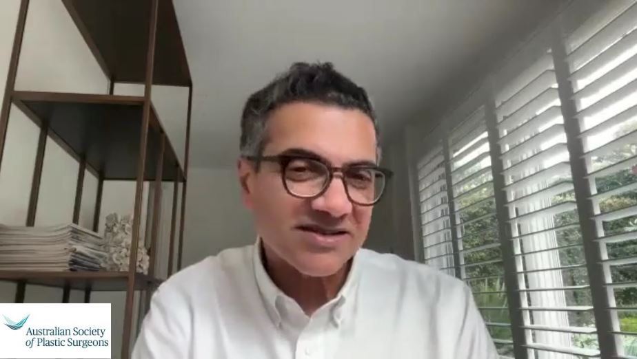 Professor Anand Deva face to camera in his study