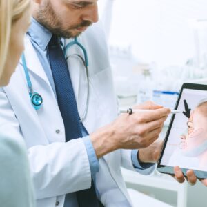 Plastic surgeon explaining a procedure to a patient