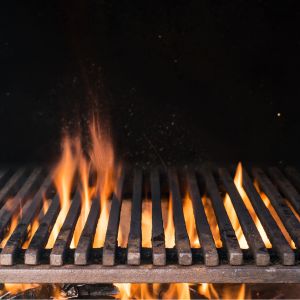 Flames over an outdoor fire at night