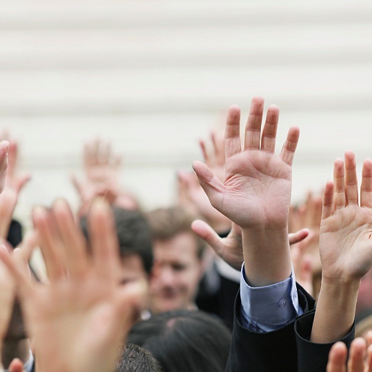 Hands up showing participation